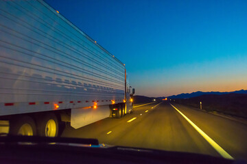 Fototapeta na wymiar Driving on highway to Las Vegas at dusk, Nevada, USA