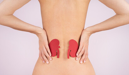 World kidney day. Loin spasm. Young woman body. Spine and kidney inflammation, pain and therapy. Womannaked body massaging pain back.