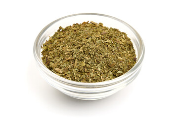 Dried basil herb, crushed basil, isolated on white background. High resolution image