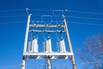 Electric pole with transformer and high voltage line
