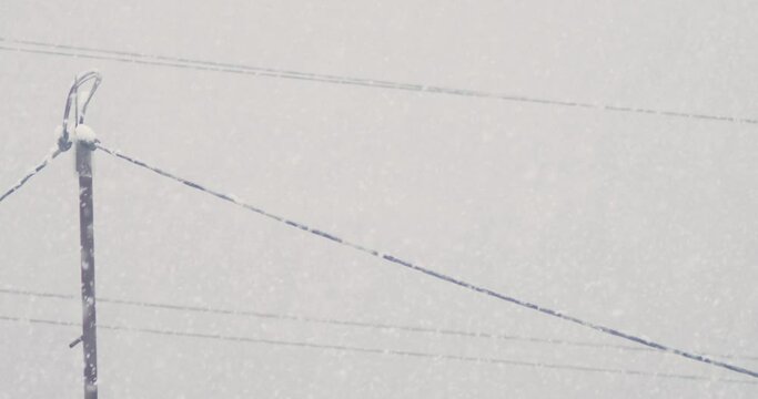 close-up . snow adhering to wires during snowfall.