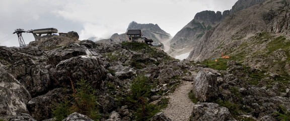 the upper station of the cable car and the chalet Rifugio Celso Gilberti in the Julian Alps in Italy