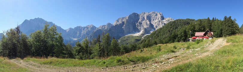 panorama with Jôf di Montasio and Jôf Fuart mountains at Grego brothers Lodge in Julian Alps, Italy