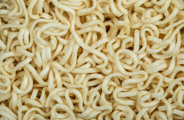 Unprepared noodles on a dark background