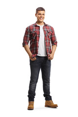 Full length portrait of a smiling young man in shirt and jeans posing