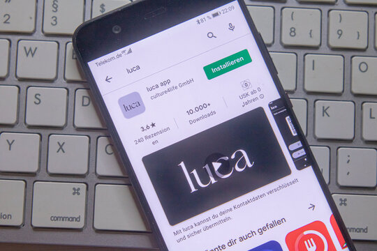 Neckargemuend, Germany: February 23, 2021: app icon of the a new german covid-app named luca on phone screen top view on keyboard, Illustrative Editorial.