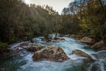 Naklejka na ściany i meble Beautiful mountain river stream in the iconic park of Fragas de Sao Simao, Portugal. Natural Park with river stream and beautiful trees in Aldeias de Xisto, Portugal