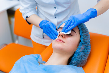 Spa procedure. Facial massage and spreading cream. Cosmetic skin care