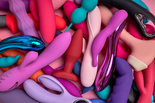 Sex toys mini vibrators g-spot dildos, a lot of accessories for sex and intimate life represented in sex shop. Different colourful dildos stir the imagination