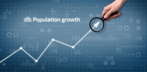 The person points to the graph of population growth on the graphical display