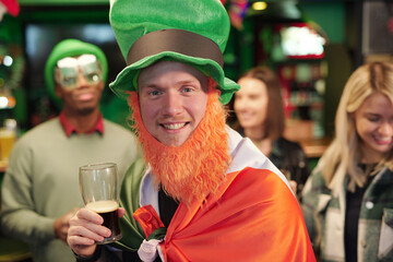 Man with beer celebrating Patricks Day