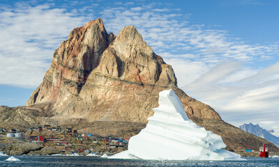 The town Uummannaq, northwest of Greenland, located on an island in the Uummannaq Fjord System. © Danita Delimont