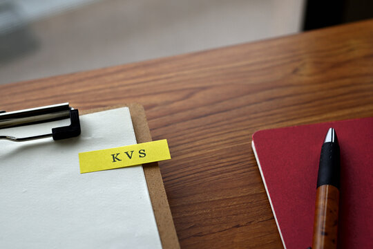 There is a notebook, a pen, and a clipboard with a sticky note stuck to it that says KVS written on it. It was an abbreviation for key value store.