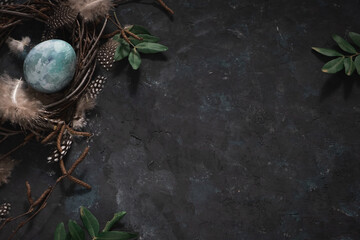 Natural dyed blue Easter eggs on dark gray background. Top view point. Easter celebration concept.