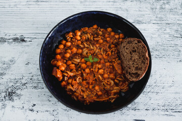 healthy plant-based food, vegan chickpea mushroom red pesto sauce with bukwheat fusilli pasta
