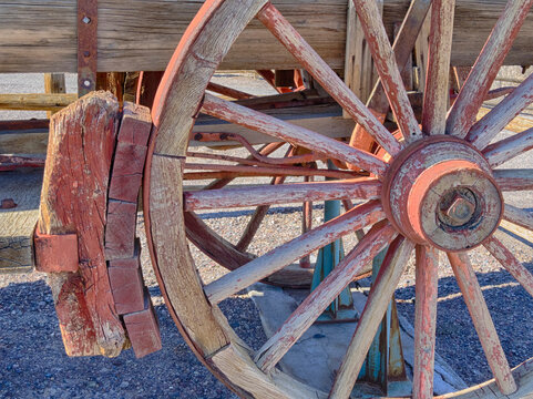 Old wagon wheel and wheel brake.