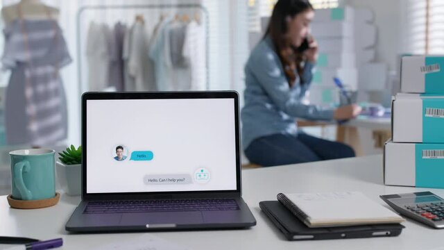 Chatbot conversation on laptop screen app interface with artificial intelligence technology providing virtual robotic assistant customer support and information for small business SME B2C concept.