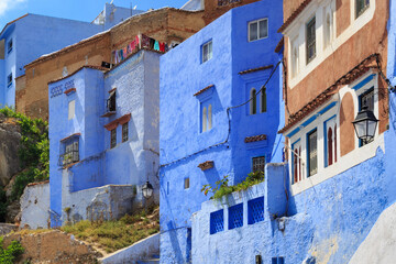 Fototapeta na wymiar View of the blue walls of Medina quarter in Chefchaouen, Morocco. The city, also known as Chaouen is noted for its buildings in shades of blue and that makes Chefchaouen very attractive to visitors.