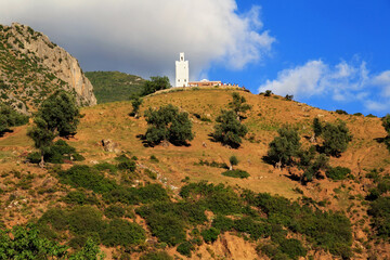 View of the Mosque Bouzaafer (or Spanish Mosque) near mountains in Chefchaouen (Chaouen), Morocco.