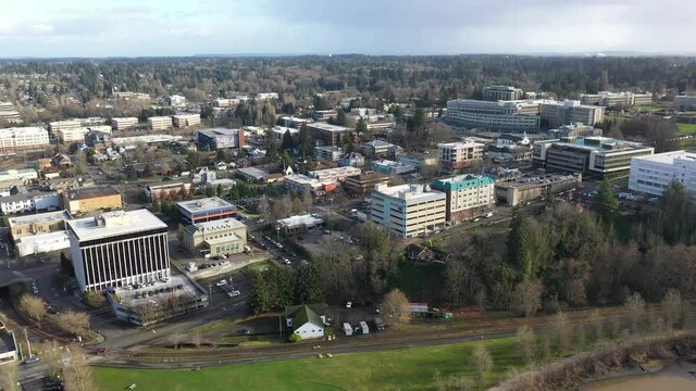 Cinematic aerial drone clip of downtown Olympia, Washington State department buildings, East Campus plaza, capitol building campus area and offices near the historic district of Olympia, Washington