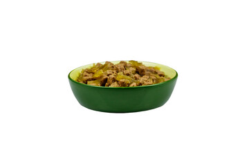 Canned food for cats or dogs in ceramic green bowl isolated on white background