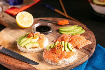 Puffed rice spread with raw salmon and avocado