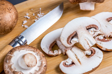 Close-up of a slice of edible mushroom on a cutting board.