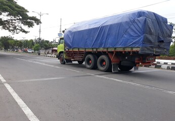 Fototapeta na wymiar truck on the highway, or truk lewat di jalan, Yogyakarta, Indonesia
