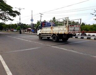 Fototapeta na wymiar truck on the road, or truk lewat di jalan, Yogyakarta, Indonesia
