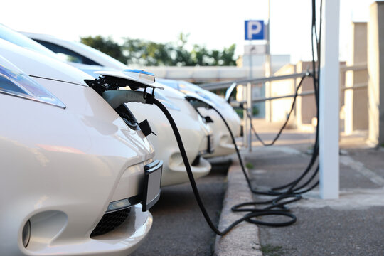 Charging Modern Electric Cars From Station Outdoors