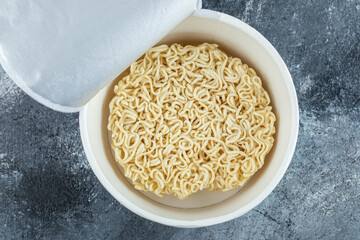 Unprepared noodles on a dark background
