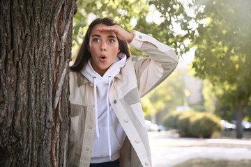 Jealous woman spying on ex boyfriend in park