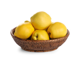 Ripe quinces in wicker basket on white background
