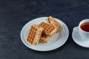 Delicious fresh waffles with a cup of tea