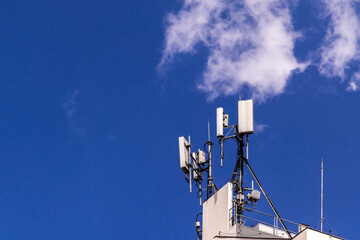 Telecommunication tower with copy space in roof top of building.Digital wireless connection...