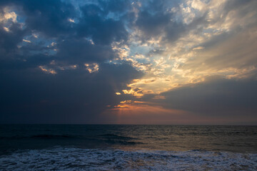 sunset over the sea with god rays