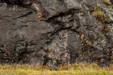 Wet Rock Face with Grassy Base