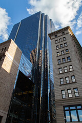 looking up at city skyscrapers