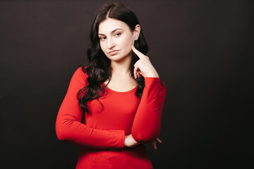 Fototapeta premium Doubtful pensive woman, background with free space