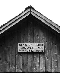 roof peak of a covered bridge in black and white