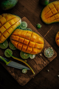 Fresh mango cut in rustic background