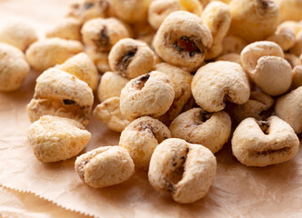 Jumbo corn baked goods placed on a cookie sheet