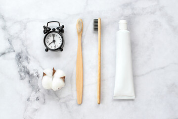 Set of eco-friendly toothbrushes, toothpaste and other tools on marble background. Dental and healthcare concept. Top view, flat lay. - 416192263