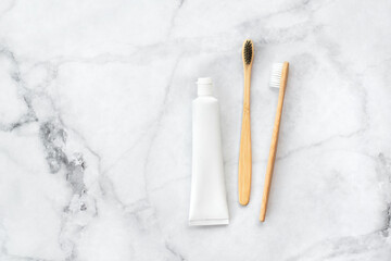 Set of eco-friendly toothbrushes and toothpaste on marble background. Dental and healthcare concept. Top view, flat lay. Free copy space. - 416192411