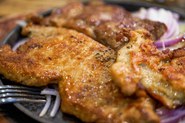 A tempting three kinds of meat steak platter, pork steak chicken steak steak