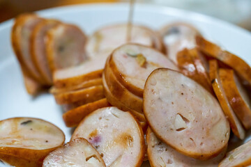 A plate of classic Cantonese cuisine, braised pork sausage, sliced sausage