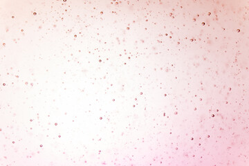 small air bubble free floating in clear liquids with light in background