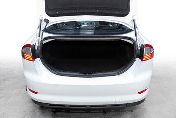 close-up of the open trunk, headlight, bumper,  front view. Exterior of a modern car .