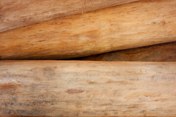 Fototapeta premium dried teak texture for building materials. utilize wood for the foundation of a traditional Indonesian house. beautiful dry wood detailing