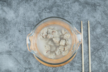 Tasty dumplings with meat on a glass plate